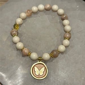 White fossil jasper and peach moonstone with butterfly charm